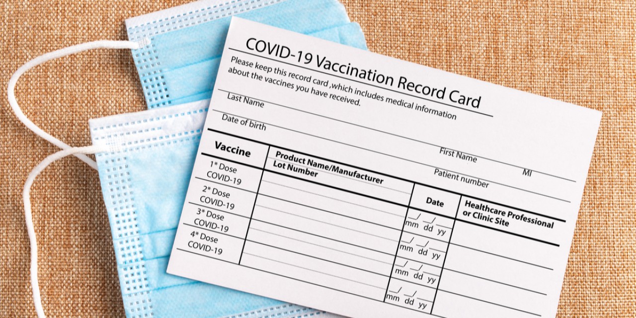 COVID 19 vaccination card and masks